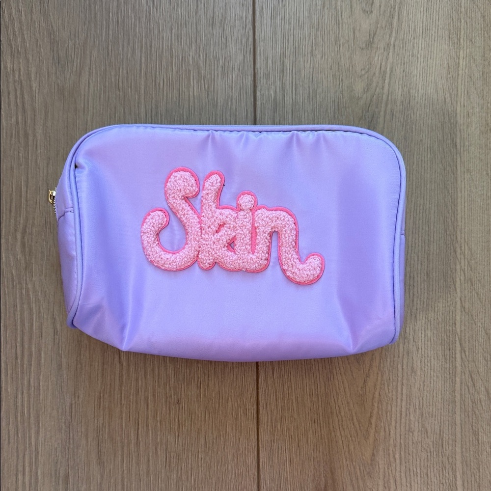Purple Cosmetic Bag with Pink 'Skin' Embroidery